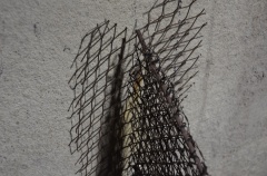 Closeup of mating of armature to existing cement of hull demonstrating lack of attachment before plastering