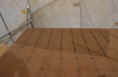 First layer of lathing cloth (expanded steel) is laid out in one direction