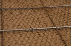 Large hand-driven staples are used to hold down the rebar for welding.  A tack or spot-welder would be more suitable for this job but I have MIG and that's what I use