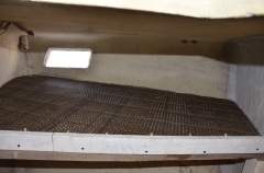 Another view of armature showing mold for front edge and dowels for holes through shelf.  Ferro-cement is extremely difficult to drill through or attach anything to with hardware.  So rather than bringing out my diamond bit drills and heavy duty hammer drill, I make the holes ahead of time